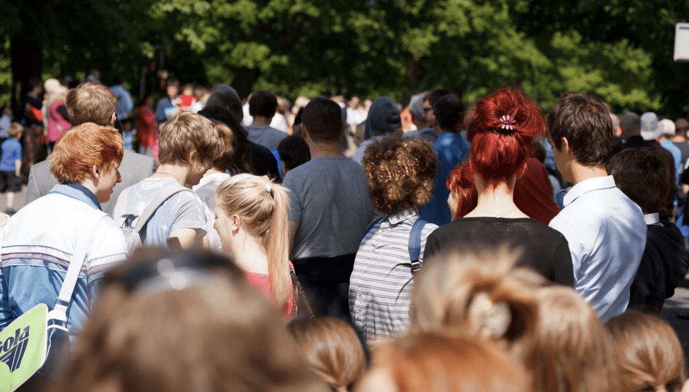 Visitors watching livestock judging in the main ring