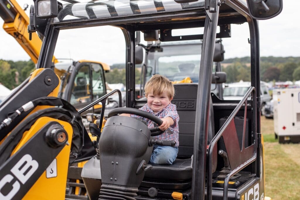 Visitors exploring tractors and machinery at The Alresford Show